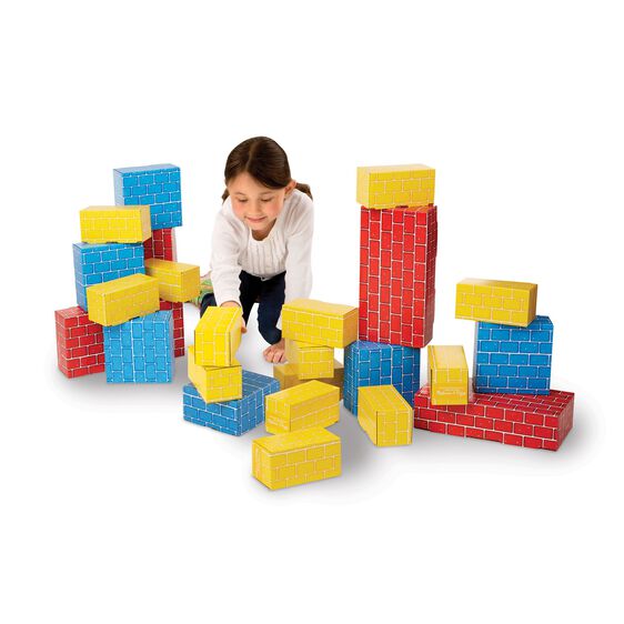 Child plays with colorful, stackable cardboard building blocks for Melissa and Doug 2783