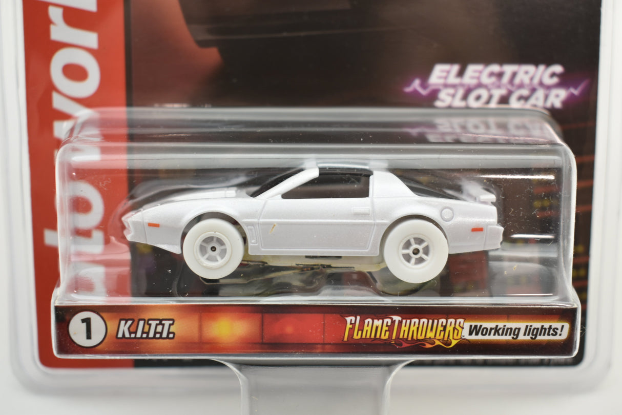 White muscle car toy, KITT, with working lights, displayed in plastic case for Auto World