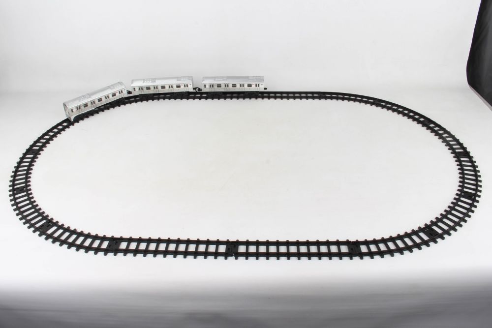 Train track set with three train cars on a white surface for Daron NY23075