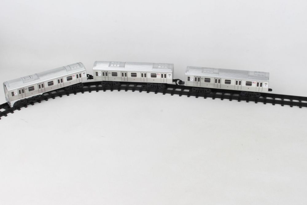 Three silver train cars on black track, representing an MTA subway set for Daron NY23075