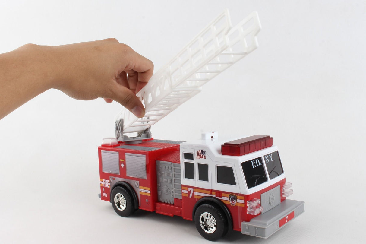 Hand raises ladder from red toy fire truck for Daron NY27200-2