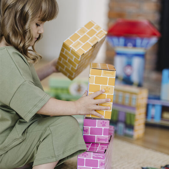 Child stacks colorful, cardboard building blocks for Melissa and Doug 33277