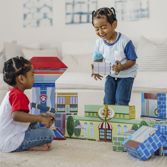 Two children play with colorful, jumbo cardboard building blocks indoors for Melissa and Doug 33277