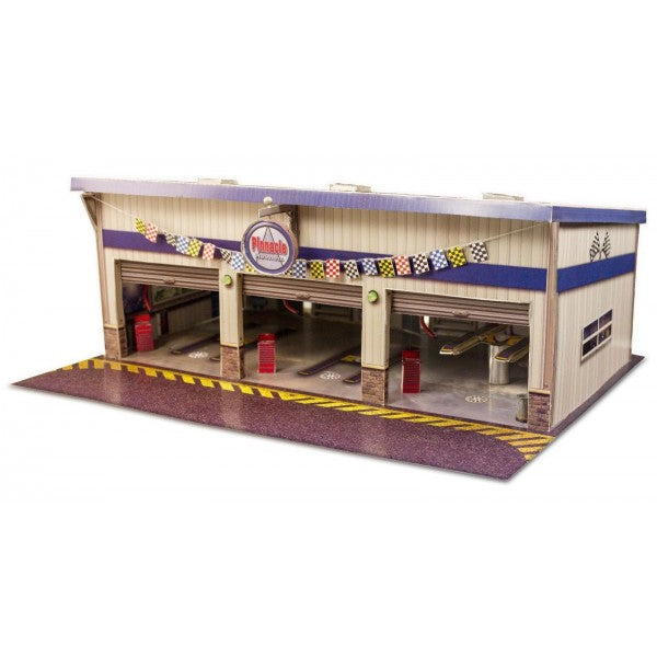 Model kit of a pit stop garage with bays and overhead structure for Innovative Hobby Supply BK6423