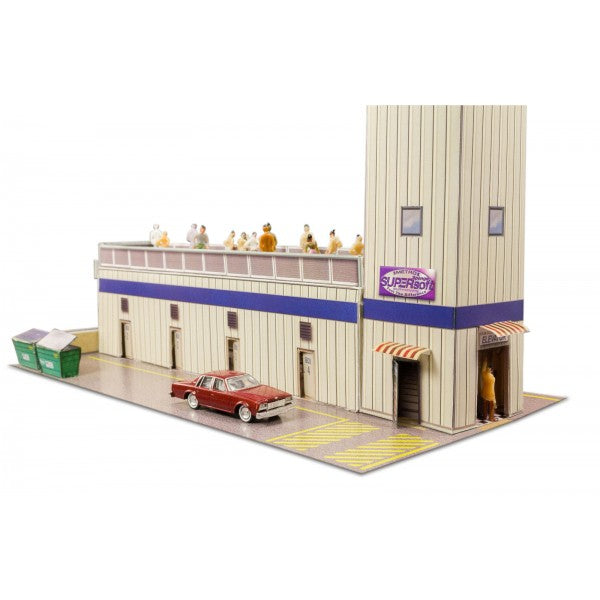 Model kit of a two-story press and media tower with a red car in front for Innovative Hobby Supply BK6424, rear view