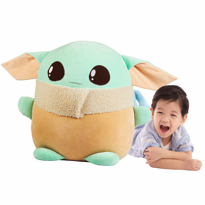Child plush toy next to a smiling child for Star Wars 1566
