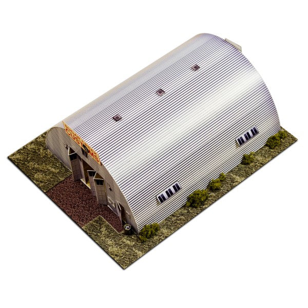 Model kit of a Quonset hut structure on a grassy base for Innovative Hobby Supply BK6400