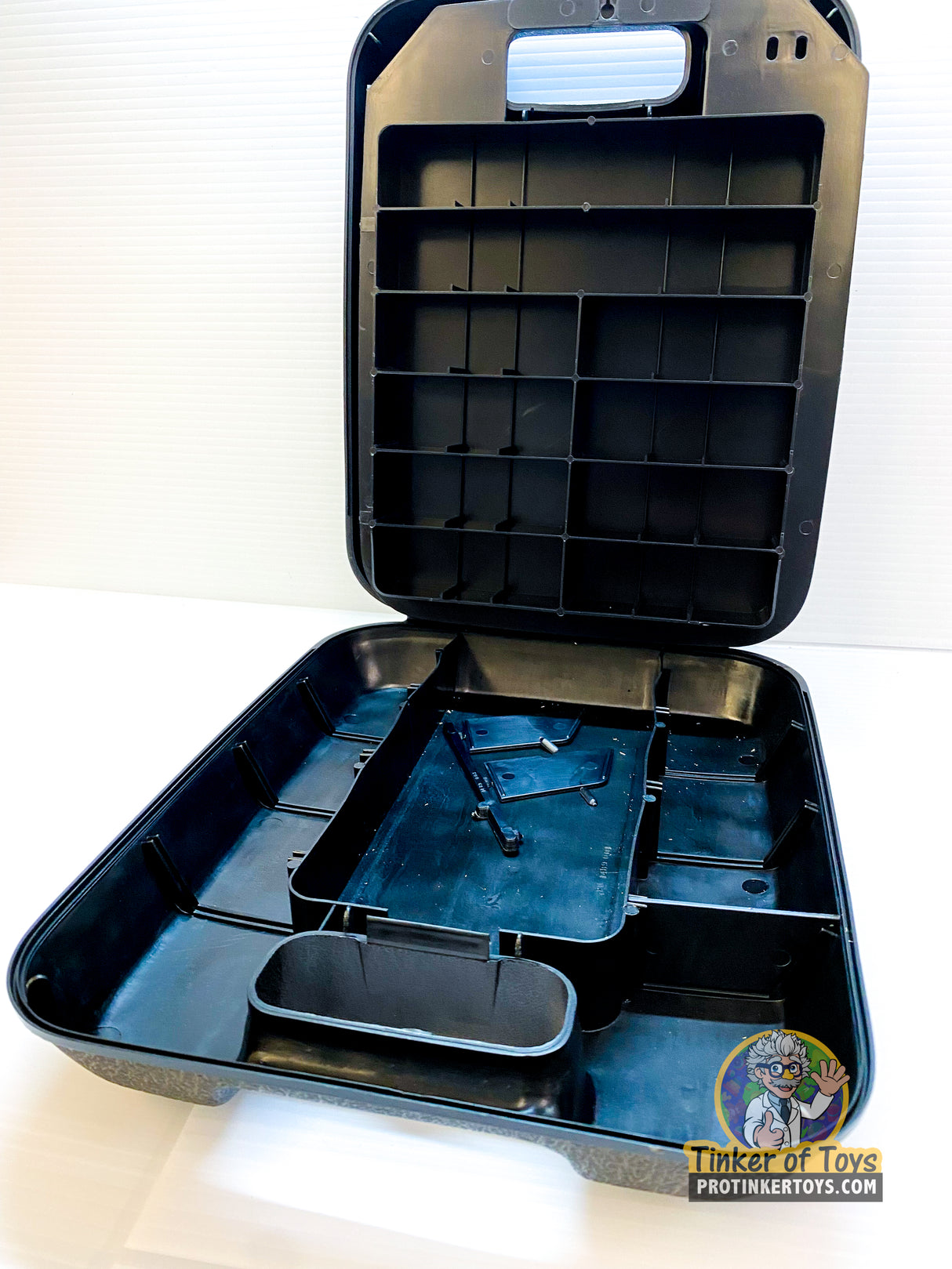 Open black case with molded compartments and removable tray for race car parts for Aurora AFX 1489