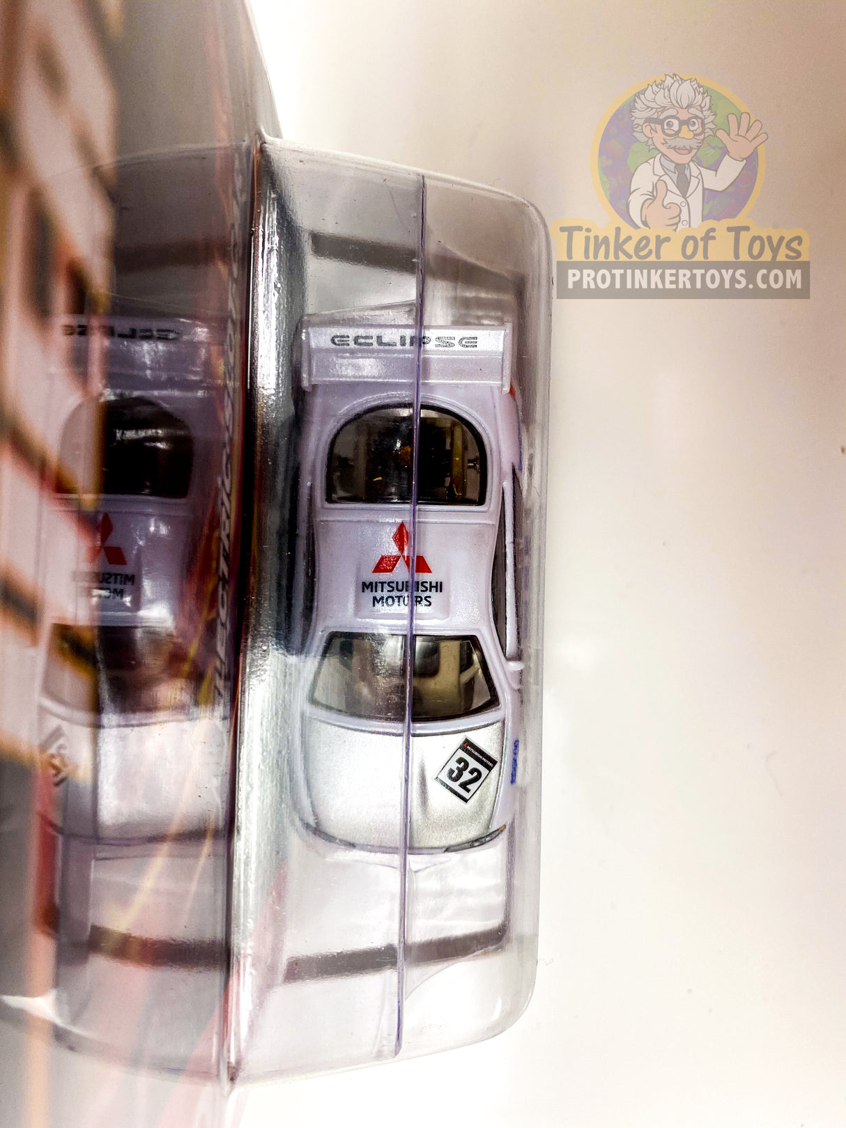 Silver slot car toy with "Eclipse" and "Mitsubishi Motors" visible for Auto World SC346