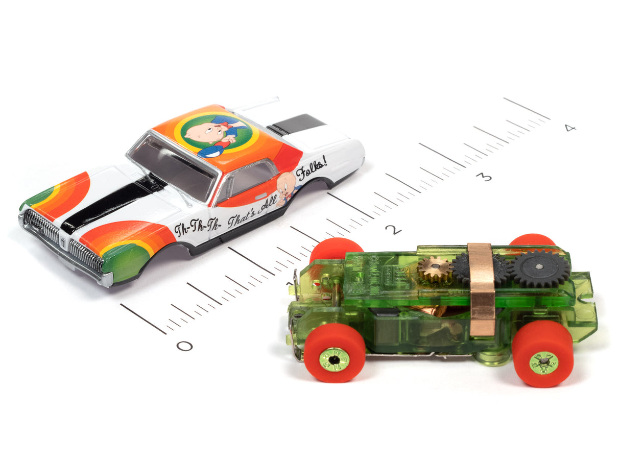 Two Looney Tunes Thunderjet toy cars on a ruler background for Auto World SC363