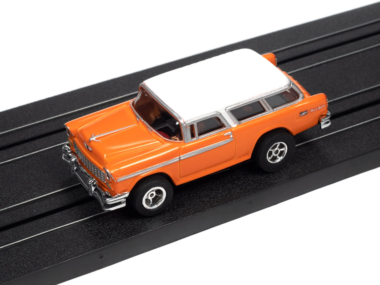 Orange and white station wagon toy car on a black track for Auto World SC366