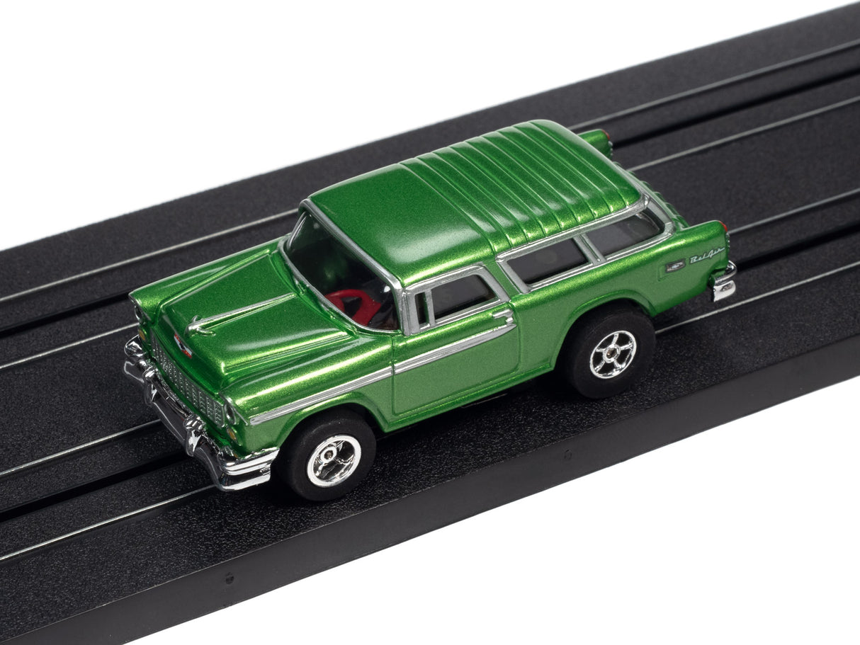 Green classic car toy on black track for Auto World SC366