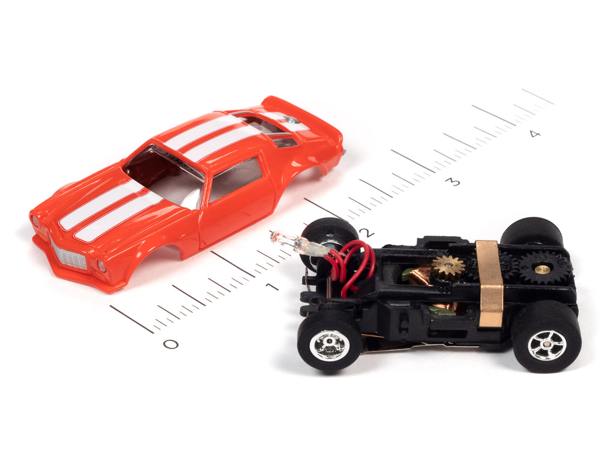 Red and black remote-controlled flamethrower car with ruler for scale for Auto World SC366