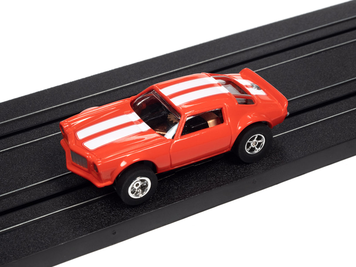 Red race car toy on a black track for Auto World SC366