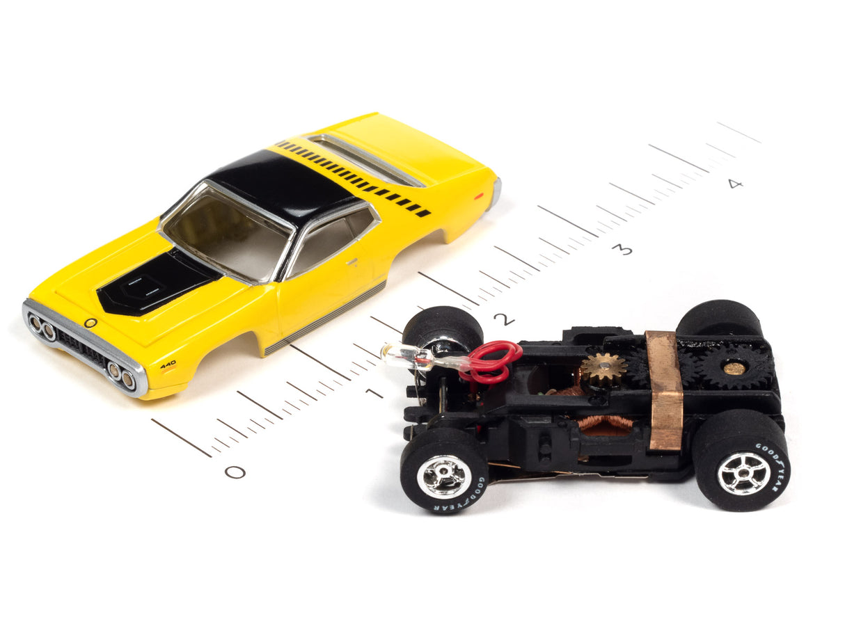 Yellow car and black flamethrower toy car on a ruler for Auto World SC366