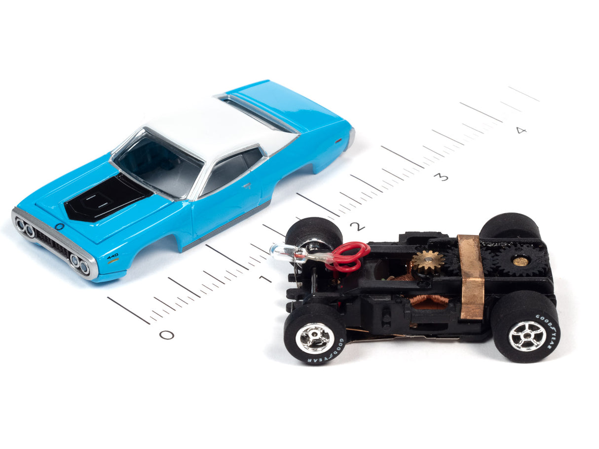 Blue car and black flamethrower toy car on a ruler for Auto World SC366