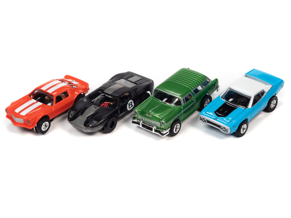 Five slot cars lined up: red, black, green, and blue for Auto World SC366