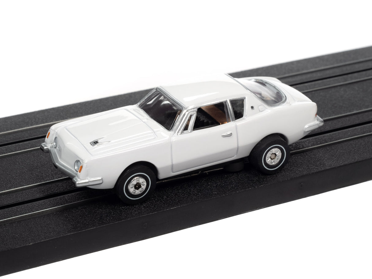 White slot car on a black track for Auto World SC367