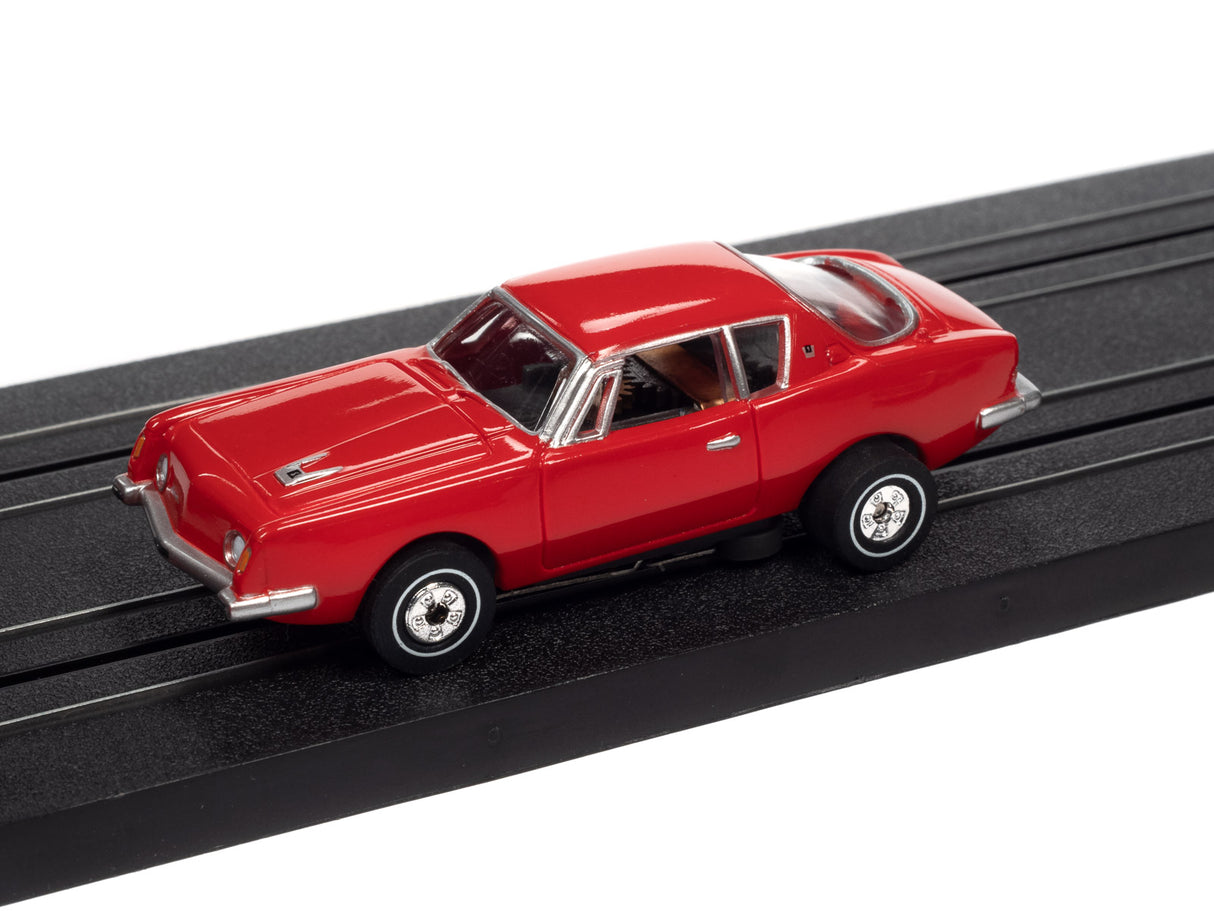 Red slot car on a black track for Auto World SC367