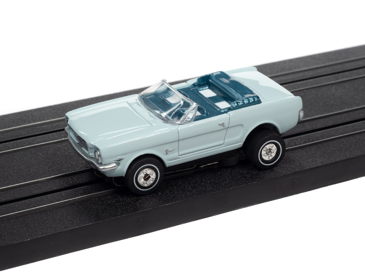 Light blue slot car on black track for Auto World SC367