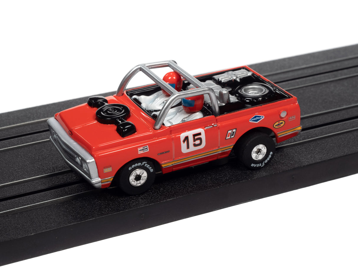 Red toy race car with number 15 on a black track for Auto World SC367