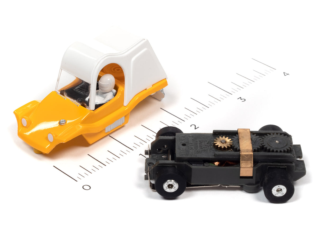 Yellow and black toy cars on a ruler scale for Auto World SC367