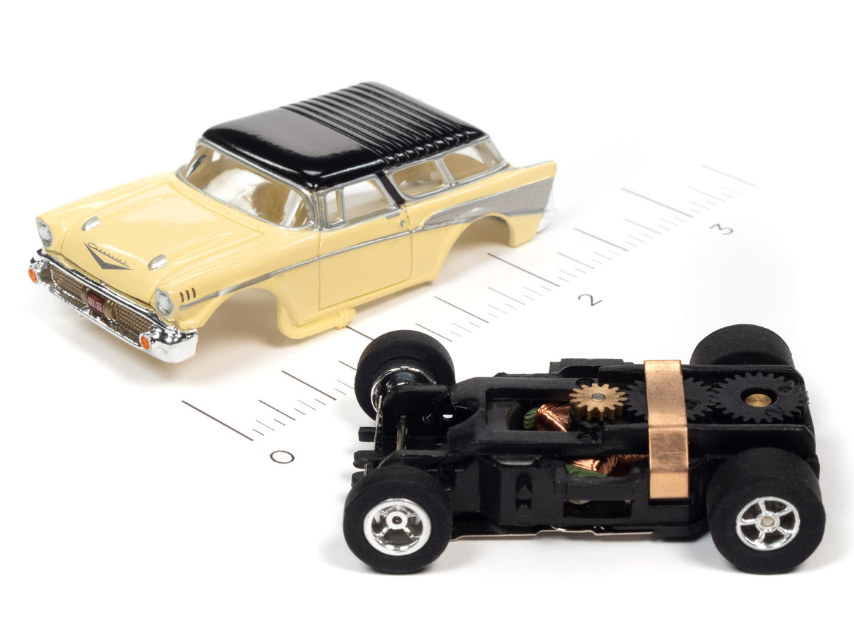 Yellow classic car model with exposed black mechanical base for Auto World SC368