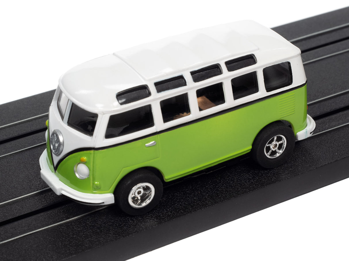 Green and white vintage bus toy car on black track for Auto World SC368