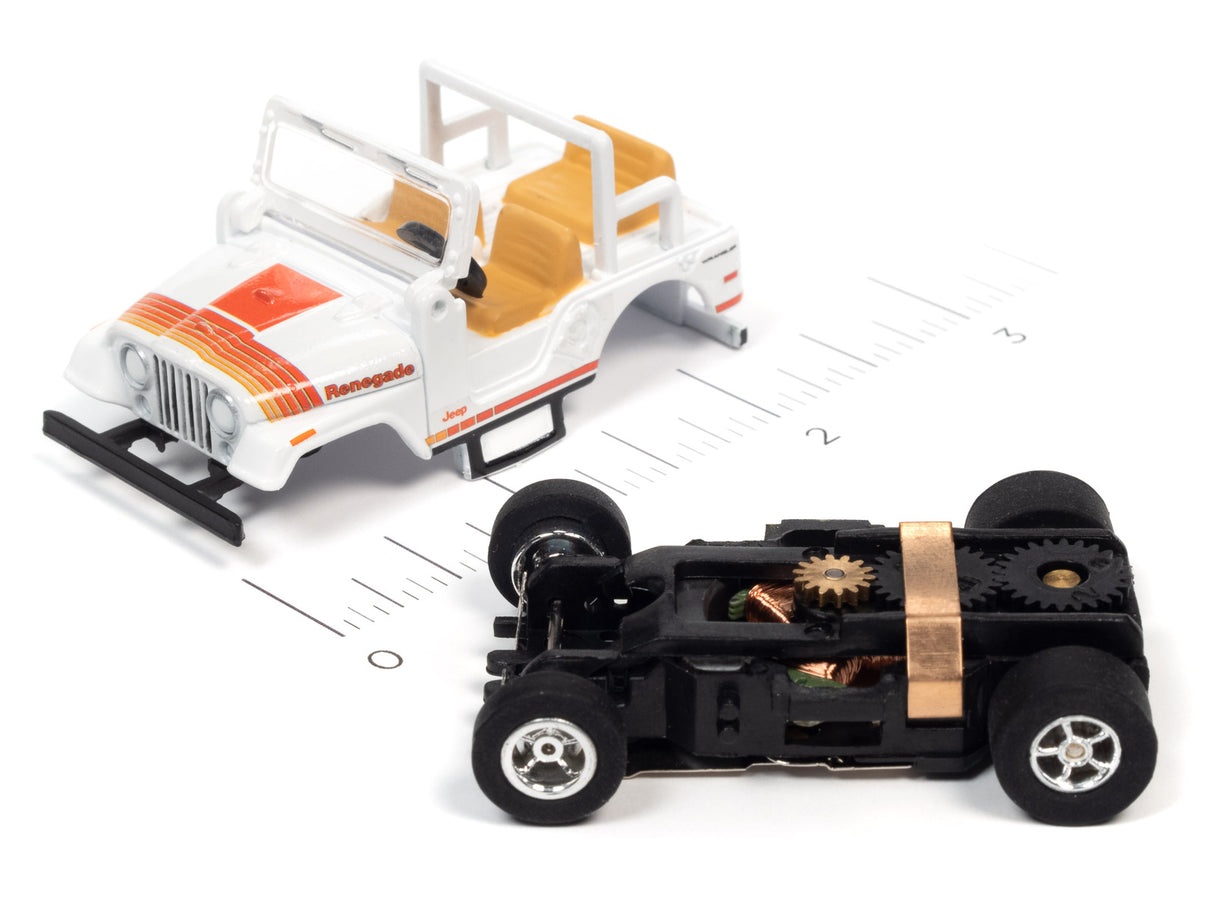 Toy Jeep and black race car on a ruler for scale comparison for Auto World SC368