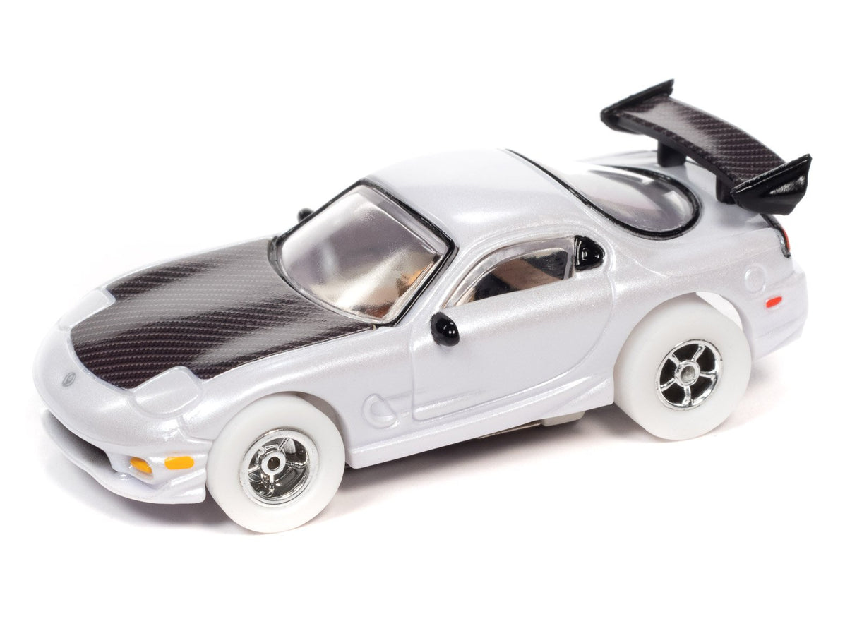 Silver slot car with black spoiler and carbon fiber hood for Auto World SC368