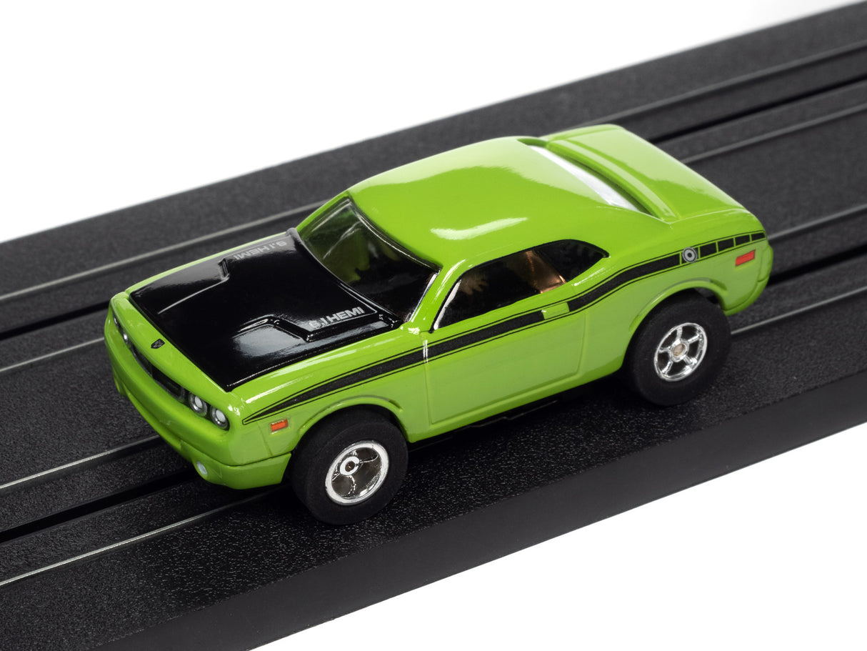Green slot car model on a black track for Auto World SC368