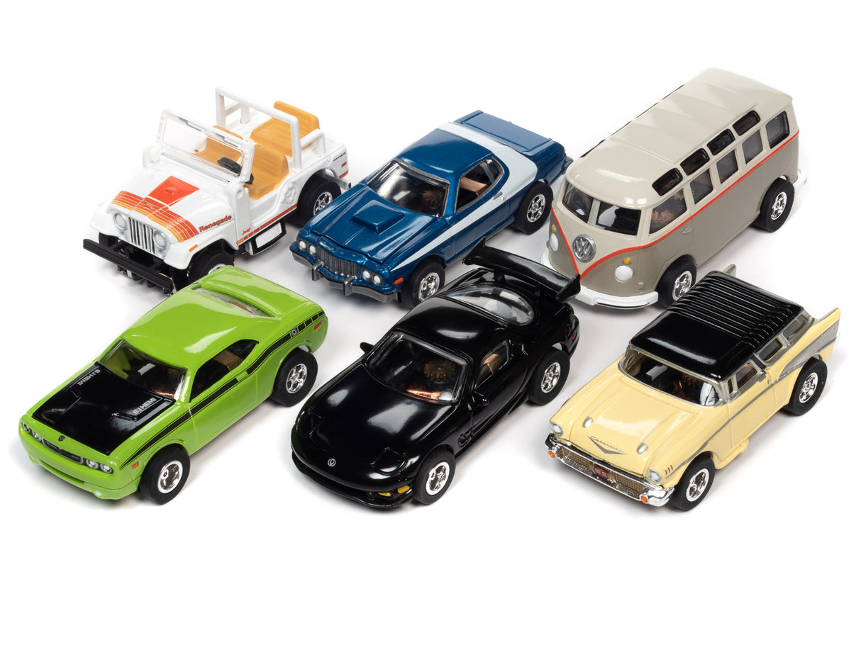 Assortment of slot car toy cars and vans on white background for Auto World SC368
