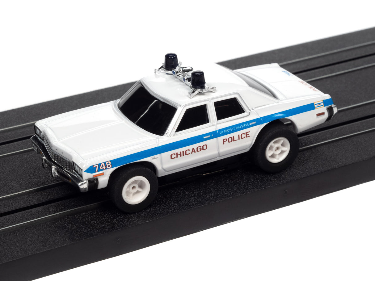 White police car toy on black track for Auto World SC372