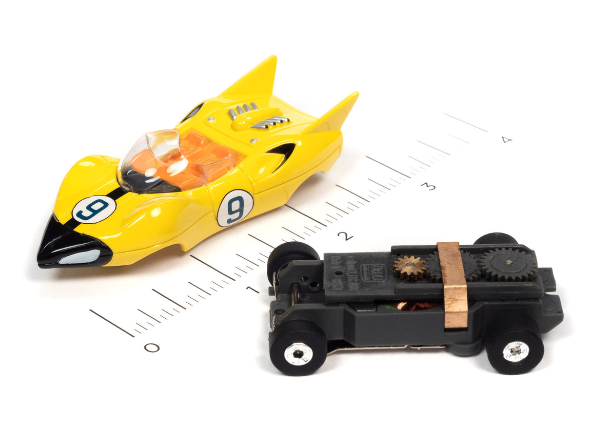 Yellow race car and black toy car on a ruler for scale for Auto World SC372