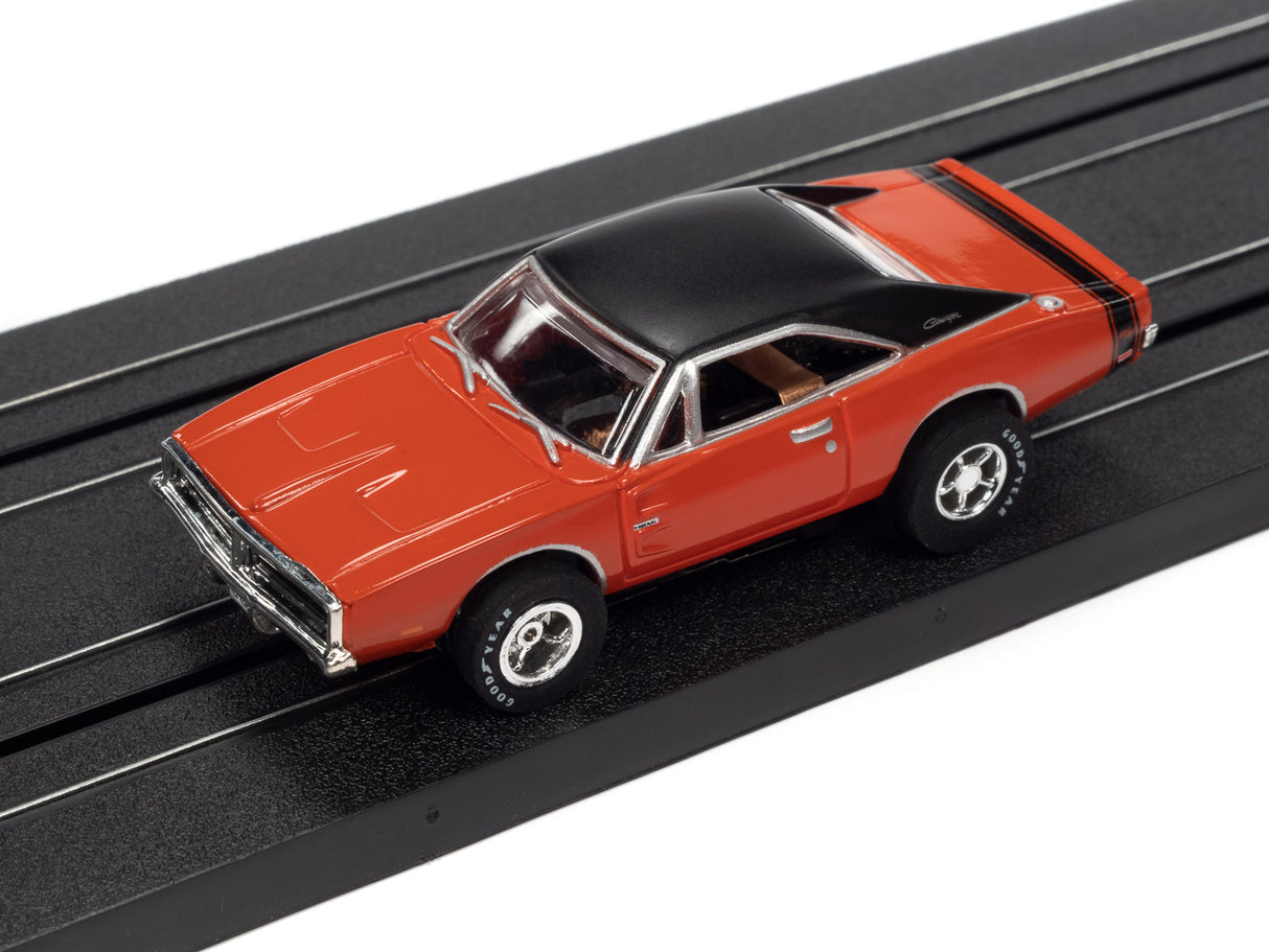 Red and black slot car on a black track for Auto World SC373
