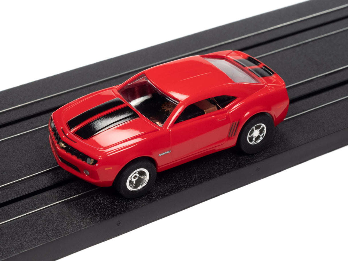 Red slot car on a black track for Auto World SC373