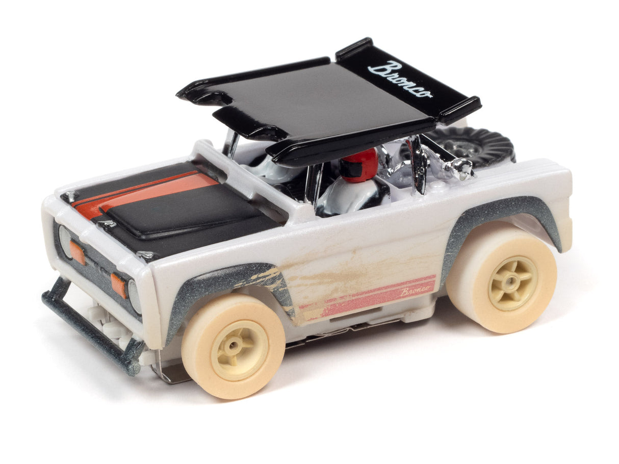 White and black off-road toy vehicle with "Bronco" lettering for Auto World SC375