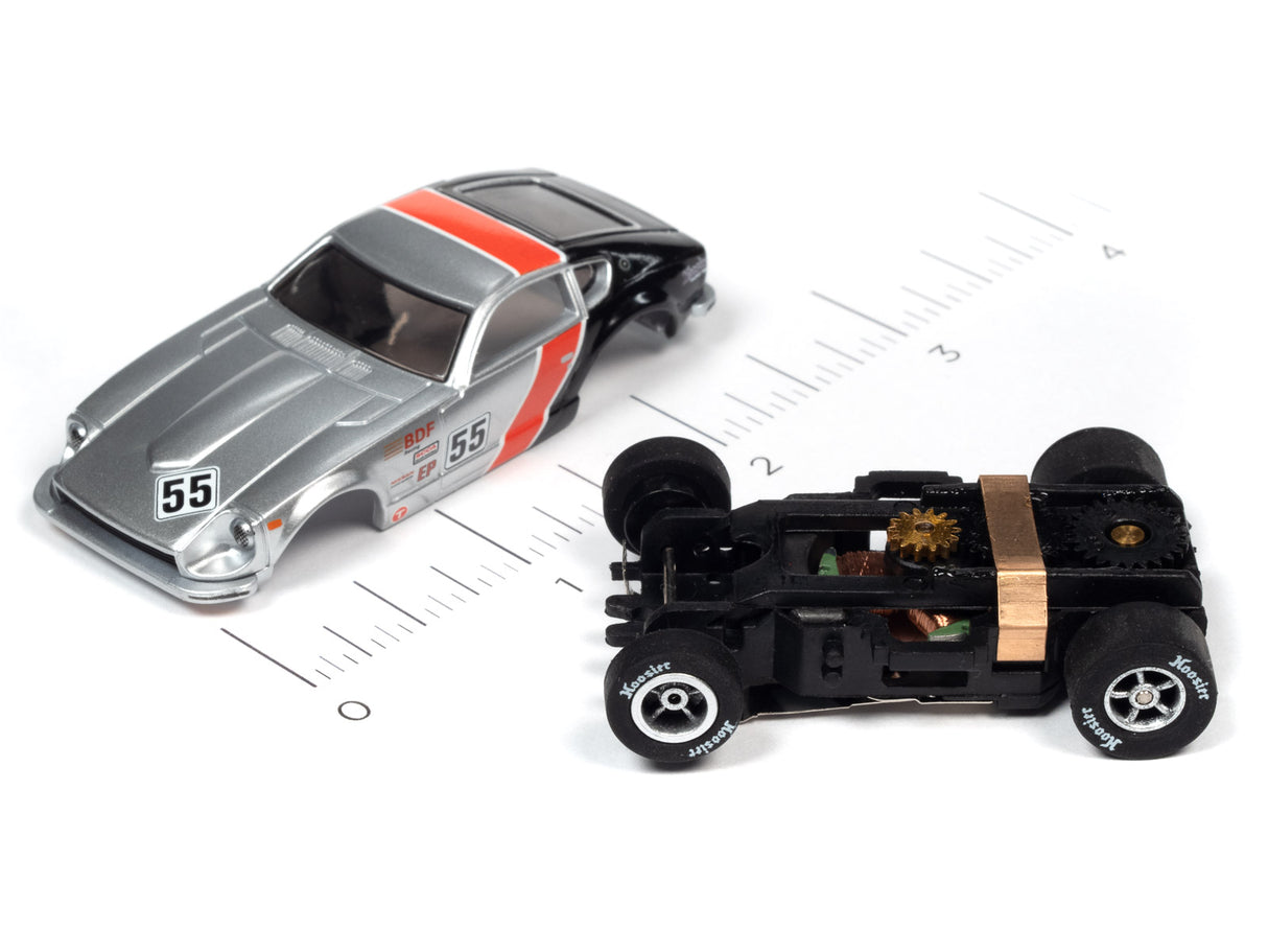 Slot car race car and exposed chassis on a ruler for scale comparison for Auto World A SC378