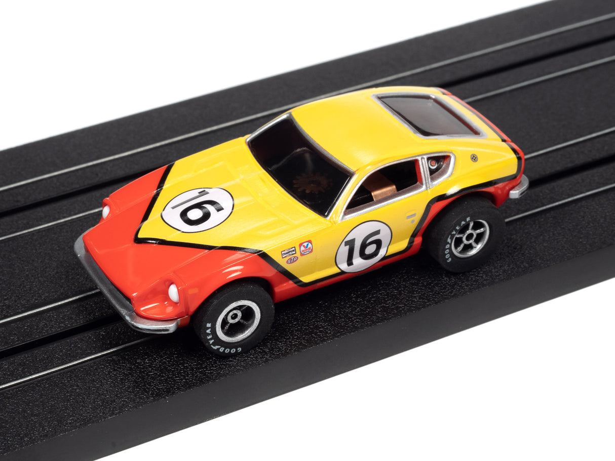 Yellow and red race car toy on a black track for Auto World A SC378