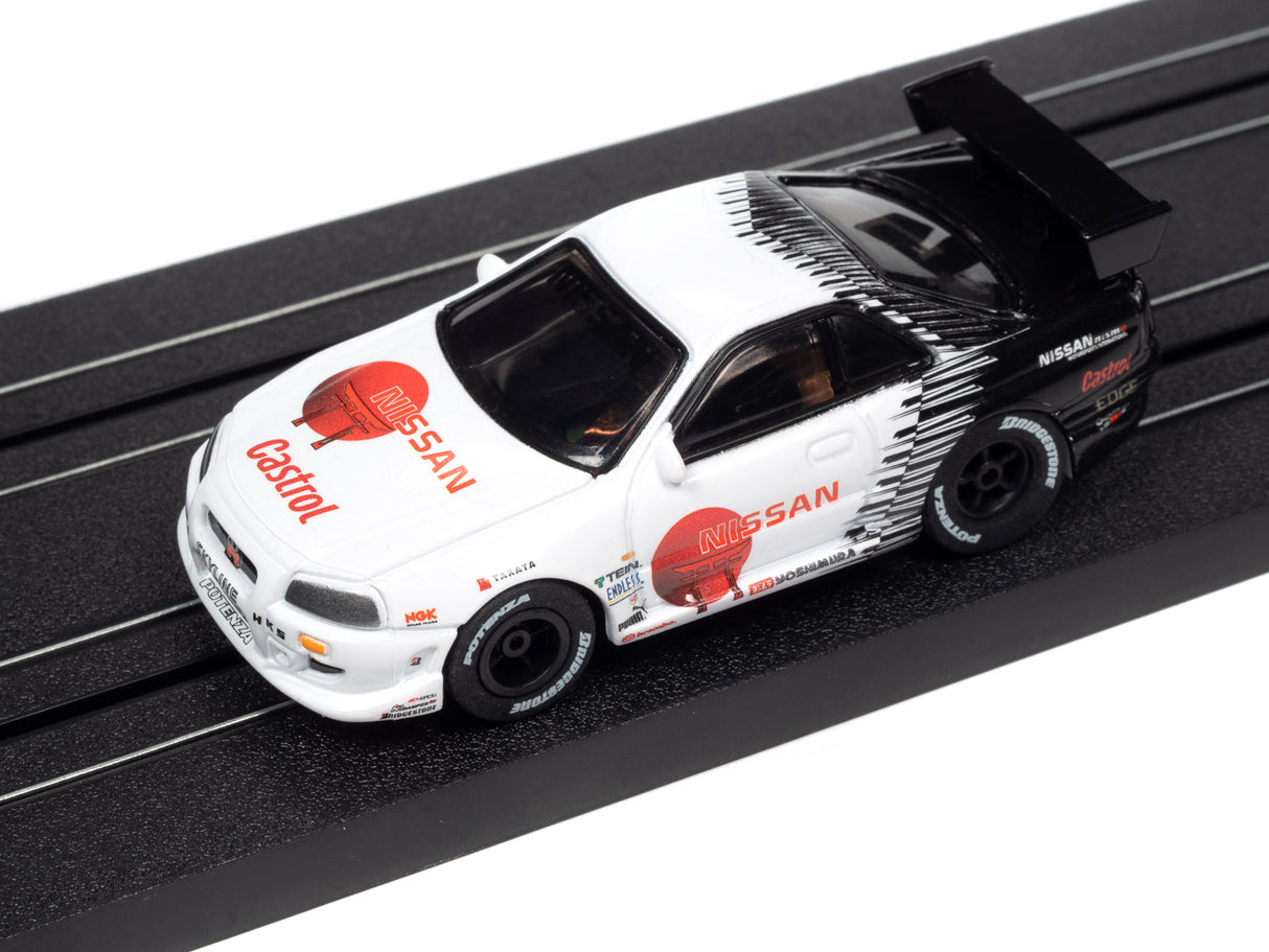 White Nissan race car model on a black track for Auto World A SC378