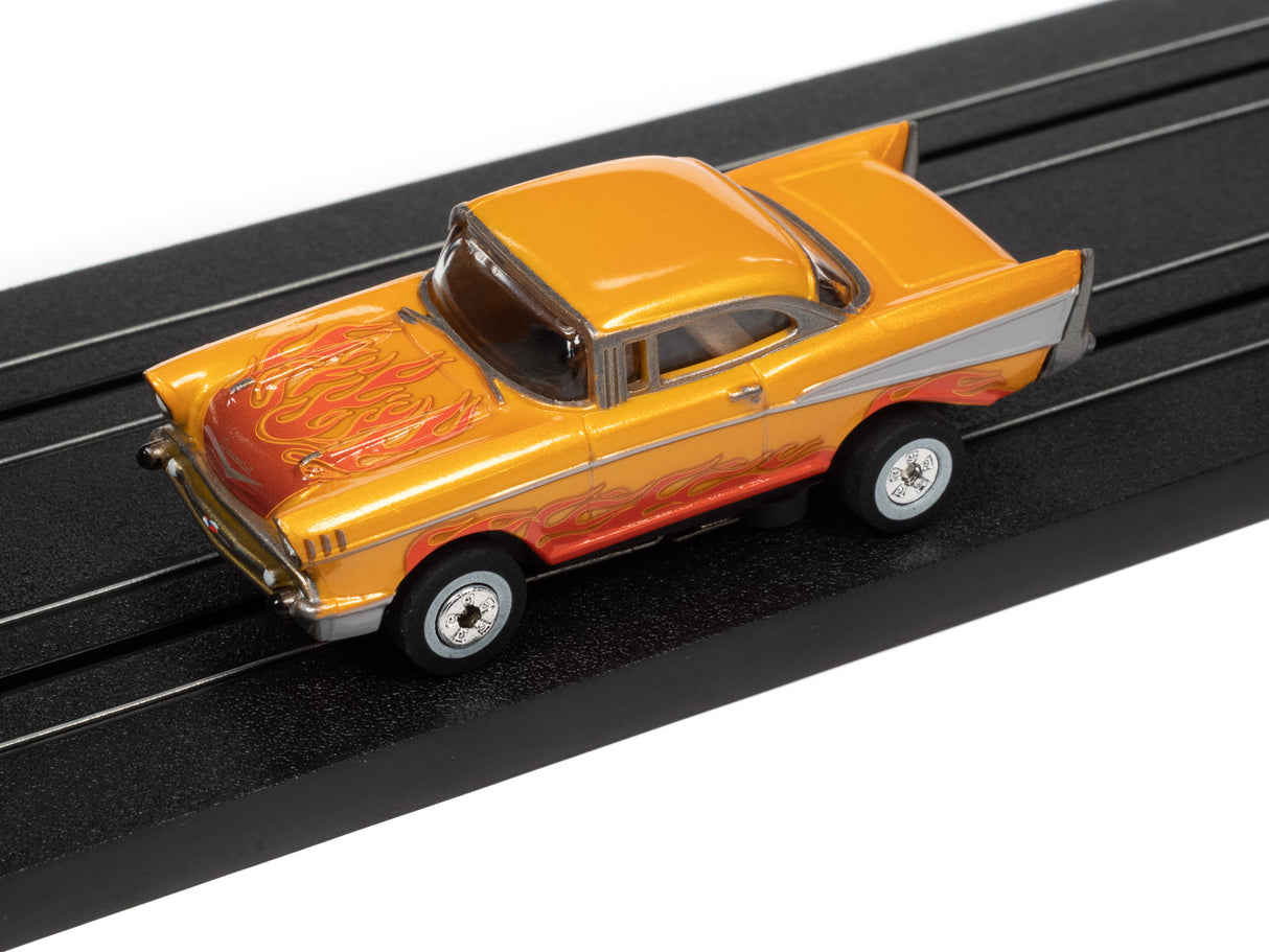 Yellow and orange classic car toy on a black track for Auto World SC379