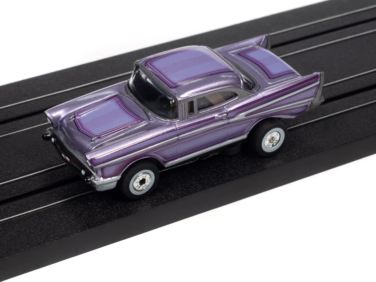 Purple classic car model on a black display track for Auto World SC379