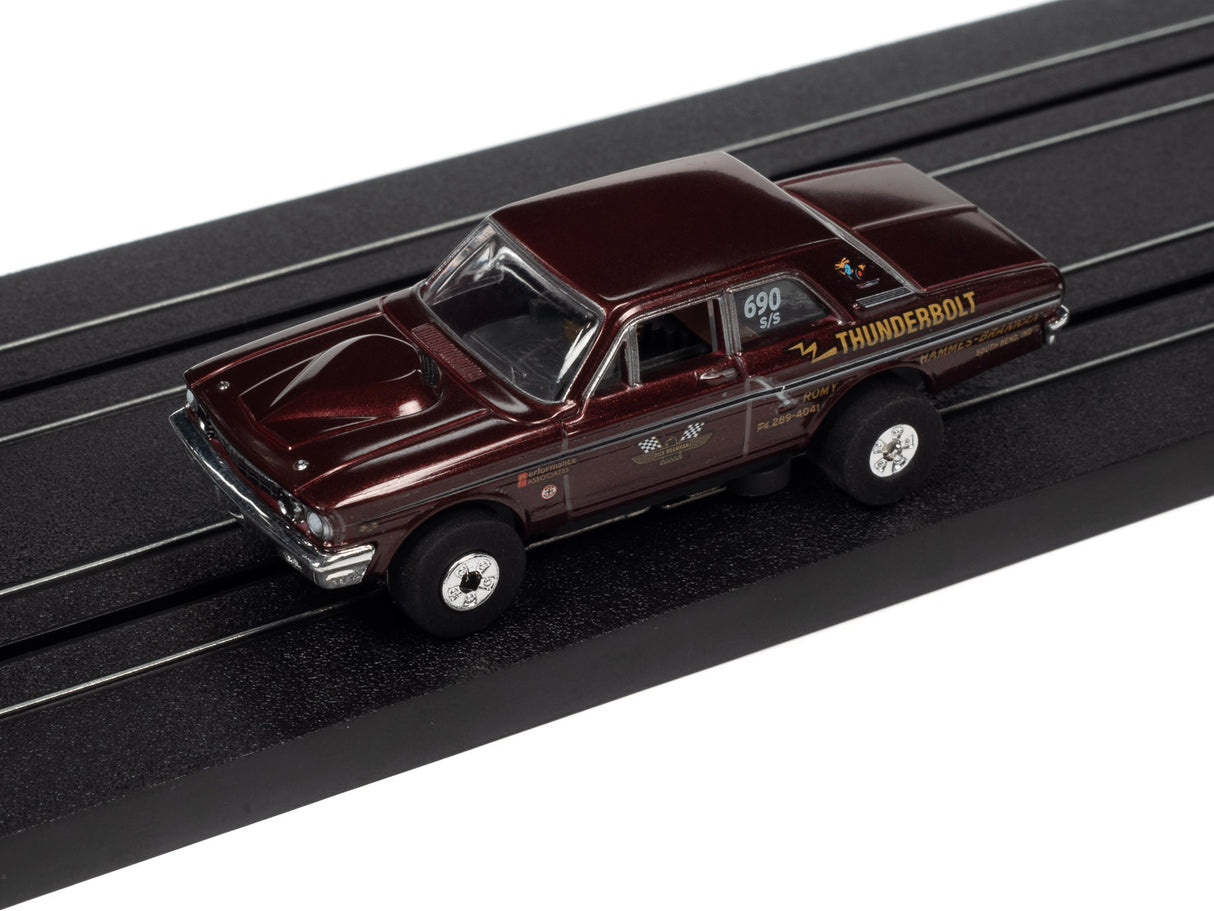 Slot car of a dark red Thunderbird car on a black track for Auto World SC379