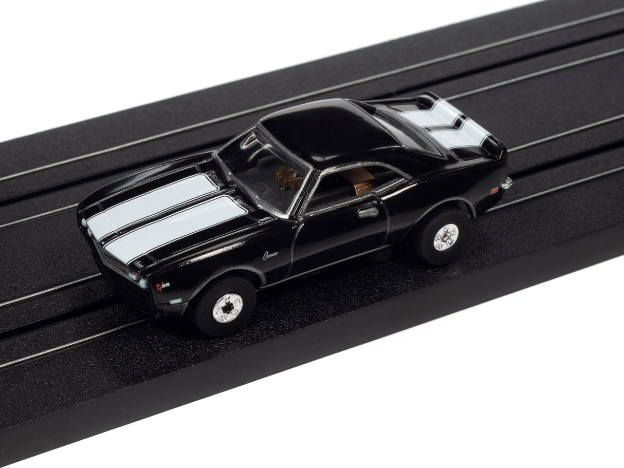 Black and white classic muscle car slot car on a track for Auto World SC379