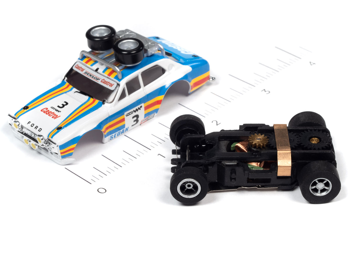 Blue and white race car and black toy car on a ruler for Auto World SC380