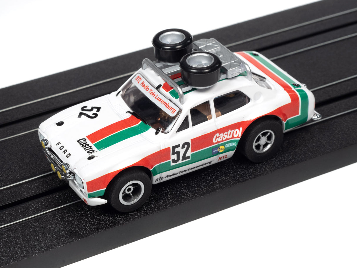 White and red race car toy on a black track for Auto World SC380