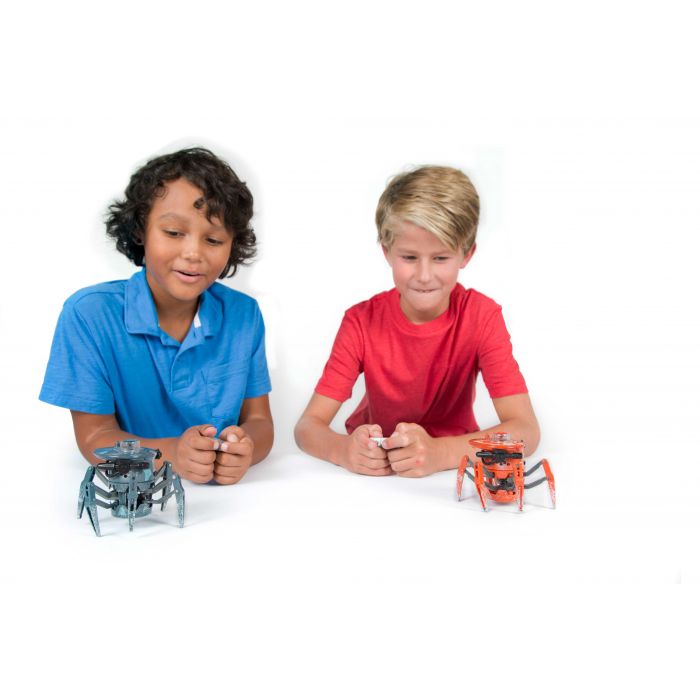 Two boys with small, robotic toys on a white background for HexBug 409-5122