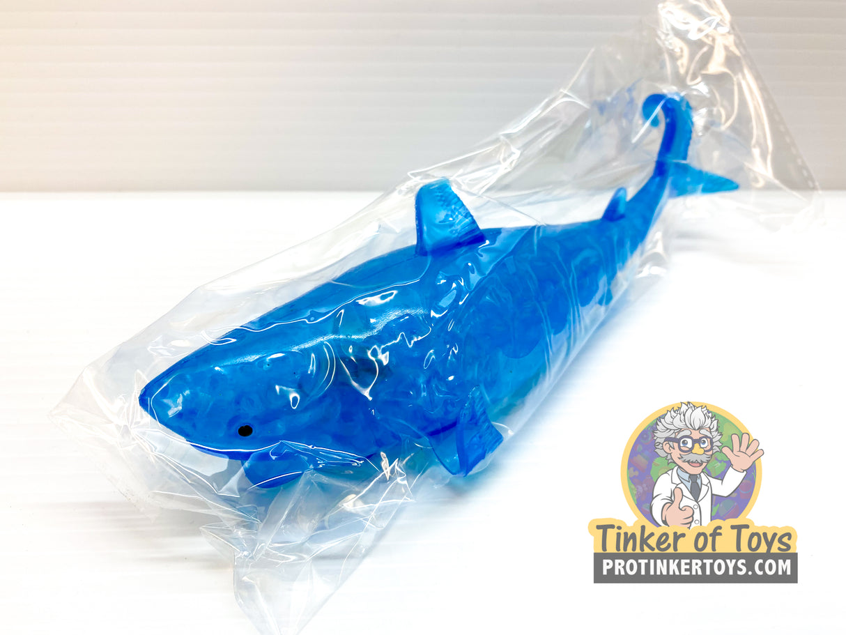Blue squishy shark toy in clear plastic packaging for BVP 87584