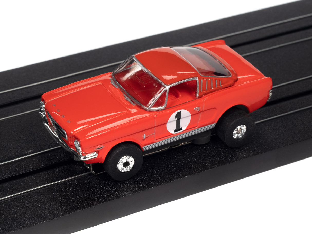 Red slot car racer on a black track for Auto World SRS341