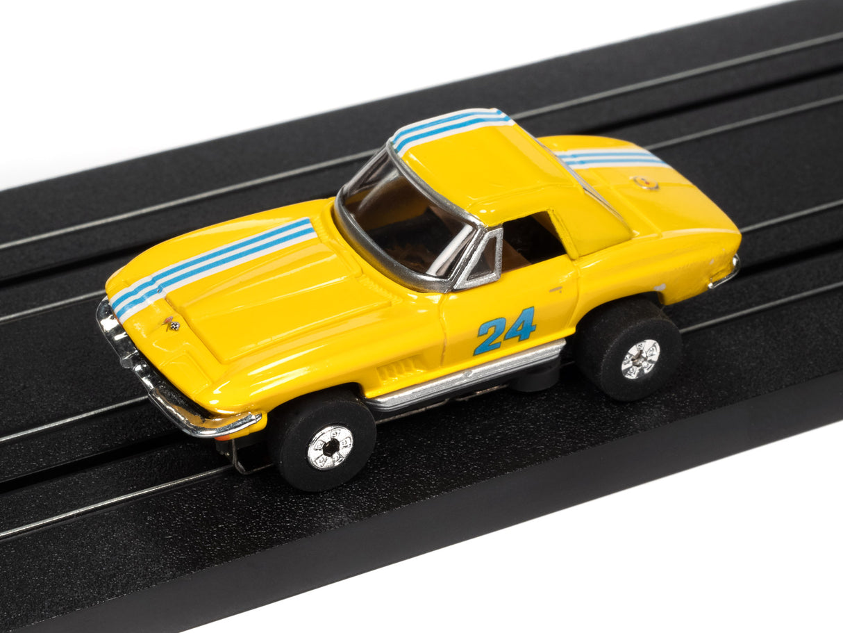 Yellow race car on a black slot track for Auto World SRS341